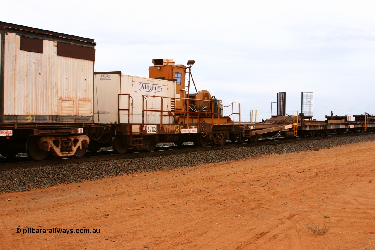 050522 2740
Goldsworthy Junction, rail recovery and transport train, flat waggon 6702, heavily cut down and modified Magor USA ore waggon by Mt Newman Mining workshops, converted to a 50 tonne waggon and designated the winch waggon with generator set to power the winch and the crib car.
Keywords: Magor-USA;Mt-Newman-Mining-WS;BHP-rail-train;