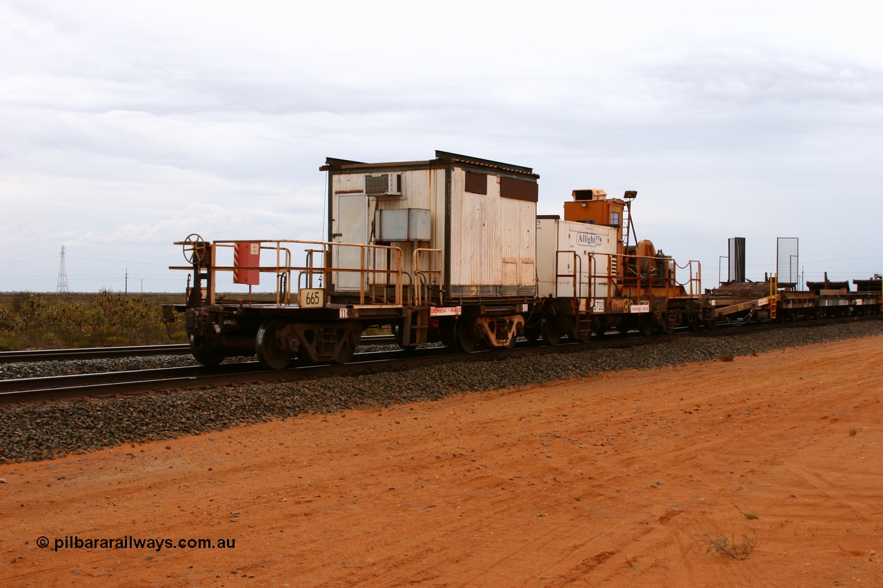 050522 2741
Goldsworthy Junction, rail recovery and transport train, flat waggon 665, a cut down Magor USA built former Oroville Dam 91 ton ore waggon, used as the crib waggon on the steel train.
Keywords: Magor-USA;BHP-rail-train;