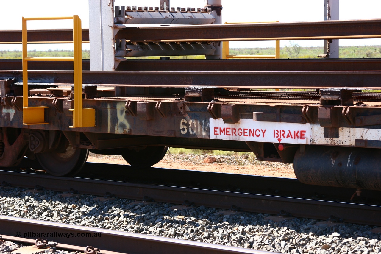 050525 2952
Mooka Siding, rail recovery and transport train flat waggon #18, 6012, built by Scotts of Ipswich Qld in September 1970, view of number board and rail support structure.
Keywords: Scotts-Qld;BHP-rail-train;