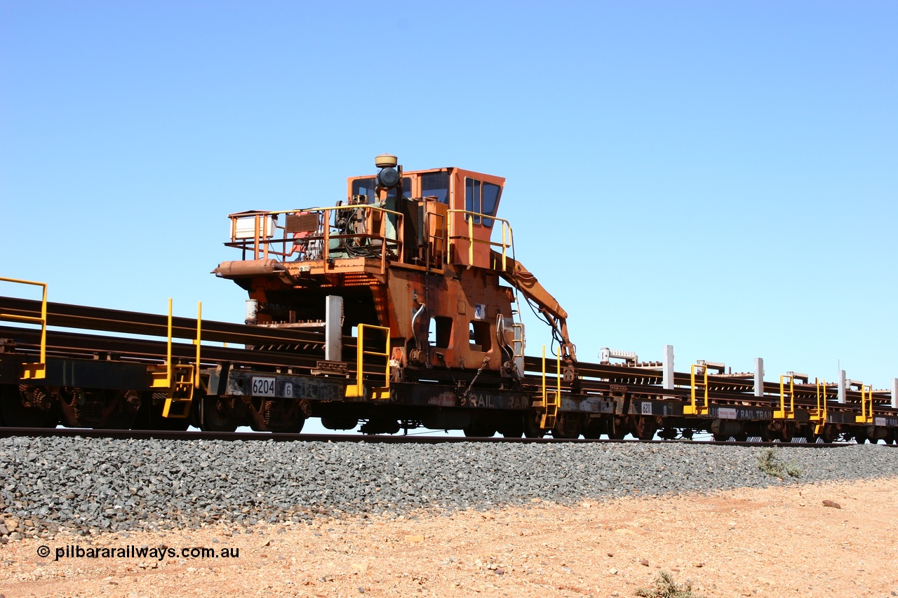 050525 2985
Mooka Siding, rail recovery and transport train flat waggon #10, 6204, built by Comeng WA in February 1977 under order number 07-M-282 RY, with the Gemco built straddle crane.
Keywords: Comeng-WA;BHP-rail-train;
