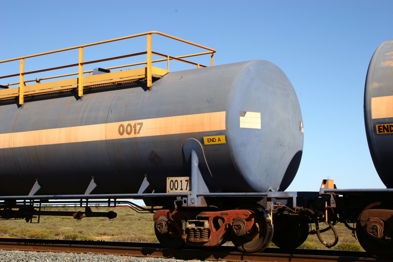 050704 3975
Bing Siding, empty 116 kL Comeng WA built tank waggon 0017 from 1974-5, one of six such tank waggons, detail of A end and bogie.
Keywords: Comeng-WA;BHP-tank-waggon;