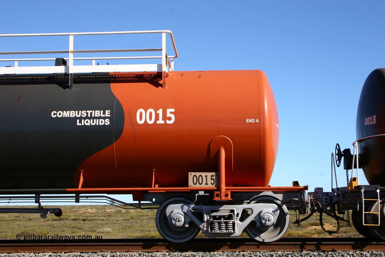 050704 3981
Bing Siding, empty 116 kL Comeng WA built tank waggon 0015 from 1974-5, one of six such tank waggons, detail of the A end and bogie, wearing the BHP Billiton Earth livery.
Keywords: Comeng-WA;BHP-tank-waggon;