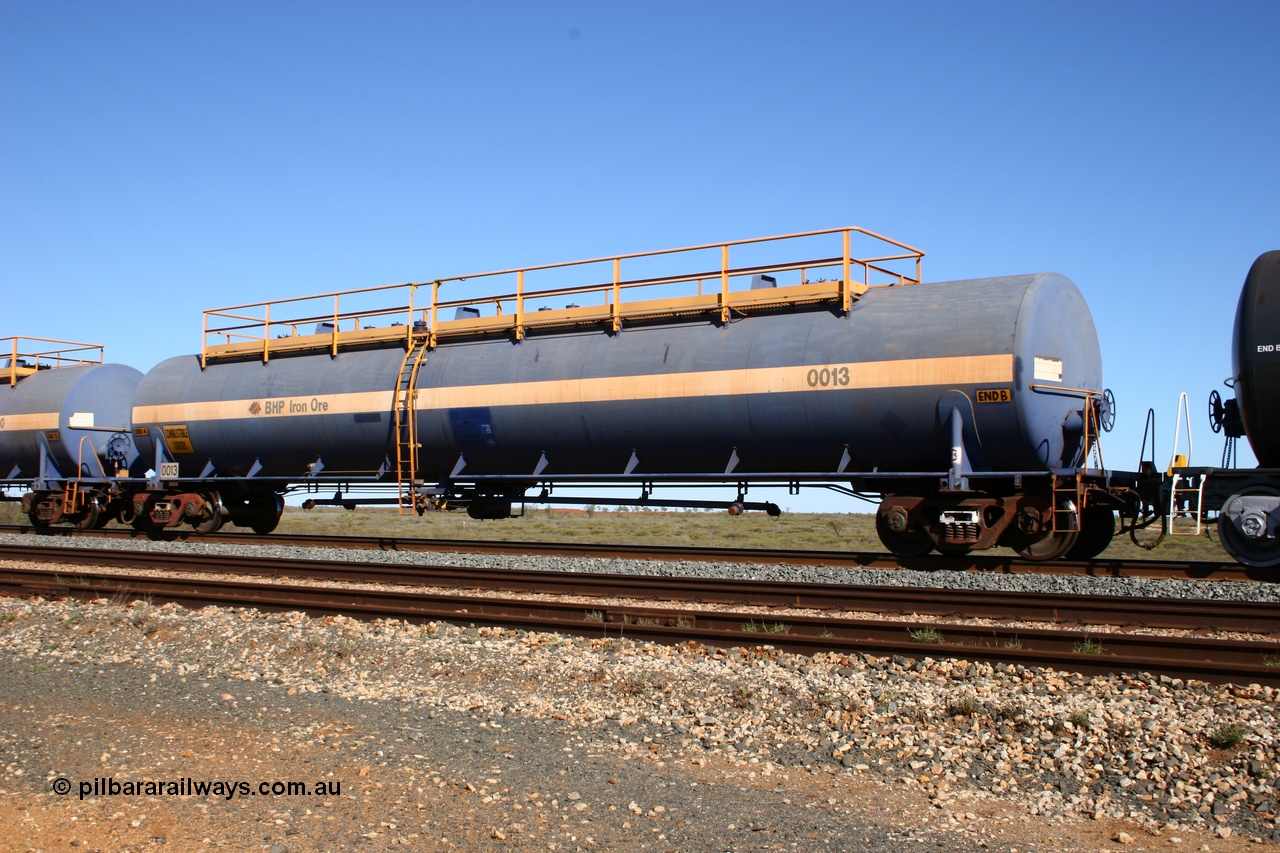 050704 3986
Bing Siding, empty 116 kL Comeng WA built tank waggon 0013 from 1974-5, one of six such tank waggons.
Keywords: Comeng-WA;BHP-tank-waggon;