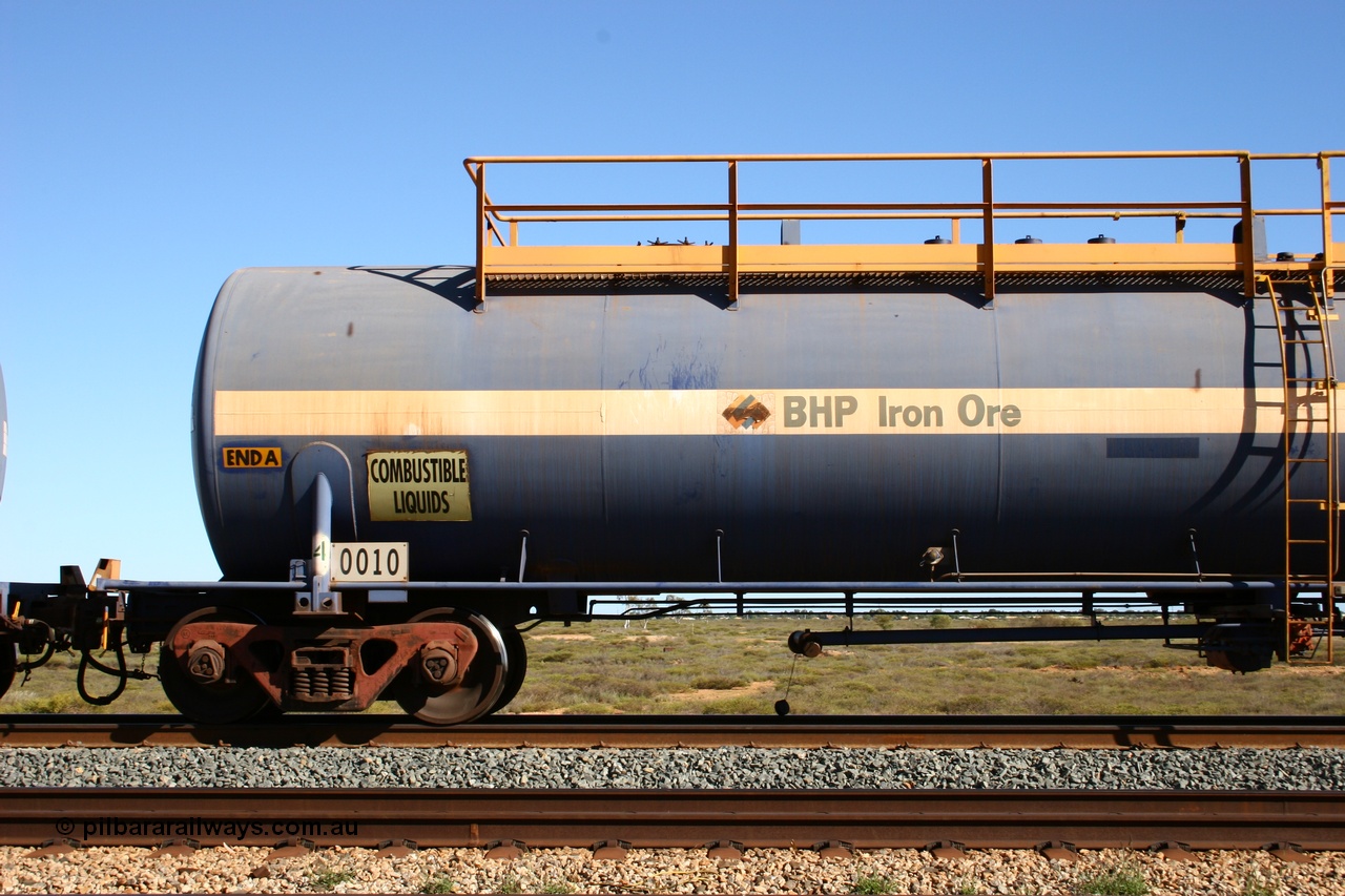 050704 3991
Bing Siding, empty 116 kL Comeng NSW built tank waggon 0010 from 1972, one of three such tank waggons, detail view of A end and bogie.
Keywords: Comeng-NSW;BHP-tank-waggon;