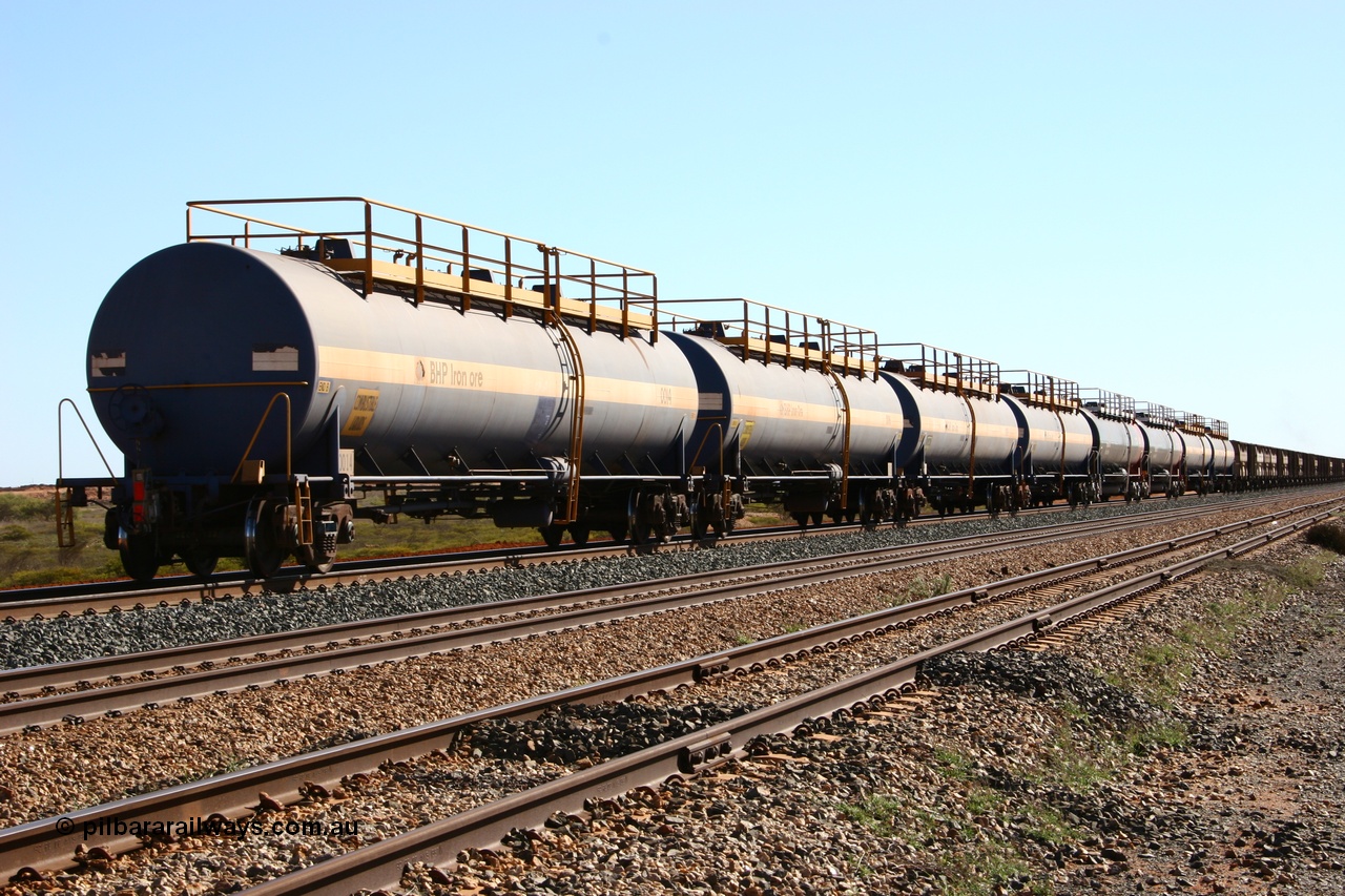 050704 3997
Bing Siding, empty 116 kL Comeng WA built tank waggon 0014 from 1974-5, one of six such tank waggons, empty tank waggons transported back to Port Hedland from Newman on the rear of loaded ore trains.
Keywords: Comeng-WA;BHP-tank-waggon;