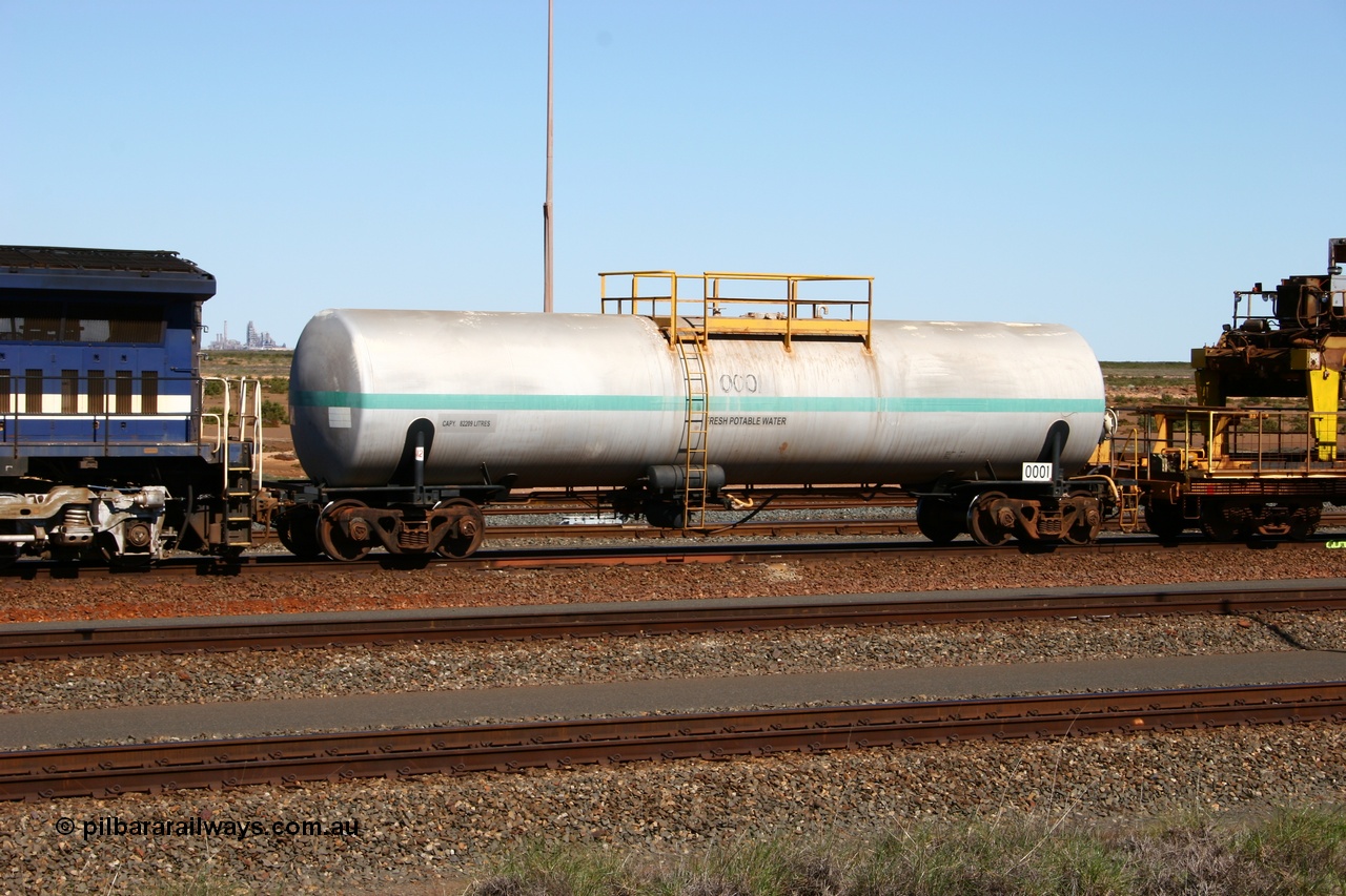 050724 4209
Nelson Point yard, Comeng NSW built 82 kilolitre water tank waggon 0001, one of two such tank waggons built in November 1970, attached to the Pony as they relay a road in the yard.
Keywords: Comeng-NSW;BHP-tank-waggon;