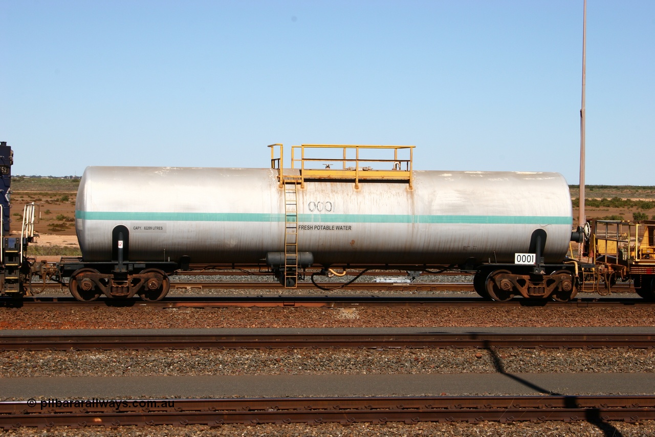 050724 4213
Nelson Point yard, Comeng NSW built 82 kilolitre water tank waggon 0001, one of two such tank waggons built in November 1970, attached to the Pony as they relay a road in the yard.
Keywords: Comeng-NSW;BHP-tank-waggon;