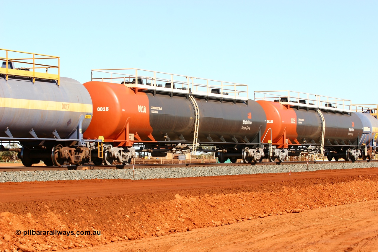 050724 4307
Bing Siding, empty fuel tank waggon 0018, a Comeng WA built 116 kilolitre tank waggon, one of a batch of six built in 1974-75 wearing the newer corporate 'Earth' livery of BHP Billiton Iron Ore.
Keywords: Comeng-WA;BHP-tank-waggon;