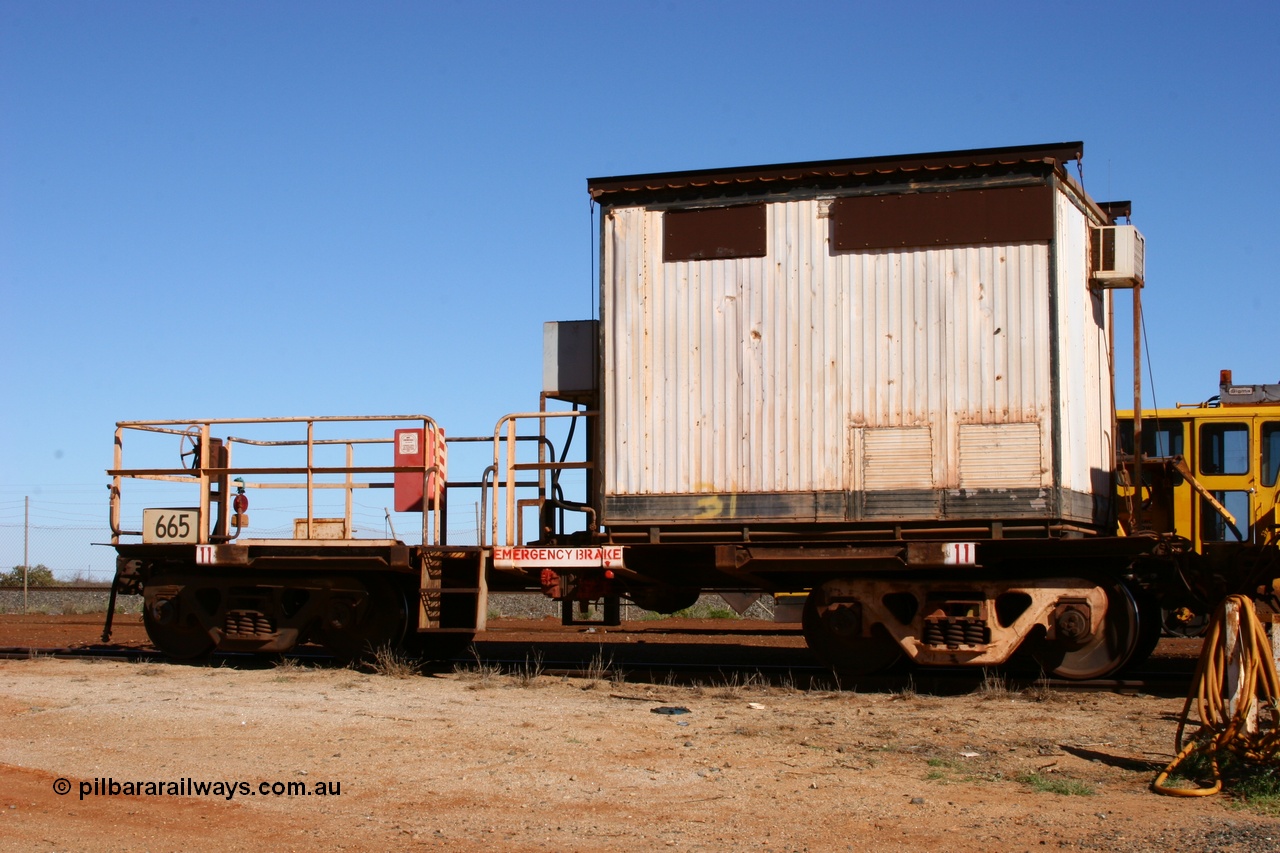 050801 4764
Flash Butt yard, rail recovery and transport train, cut down by Mt Newman Mining workshops, a Magor USA built former Oroville Dam 91 ton ore waggon 665, seen here being used as the crib waggon on the end of the steel train.
Keywords: Magor-USA;BHP-rail-train;