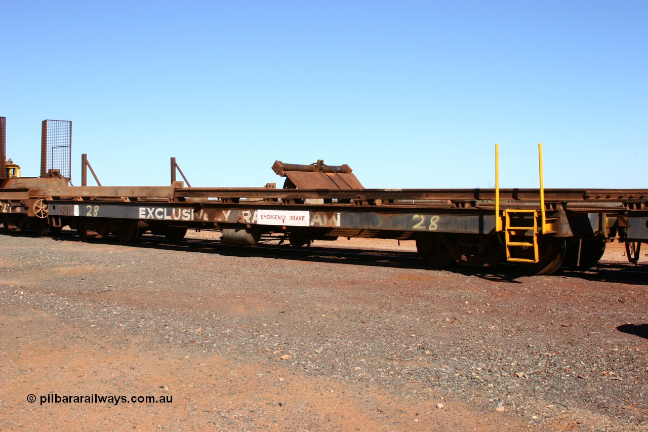 050801 4767
Flash Butt yard, rail recovery and transport train, #28 2nd lead off waggon 6201, built by Comeng WA January 1977 under order no. 07-M-282 RY, the mesh guarding is for the winch cable. The chute arrangement for the discharging and recovery of rail is visible.
Keywords: Comeng-WA;BHP-rail-train;