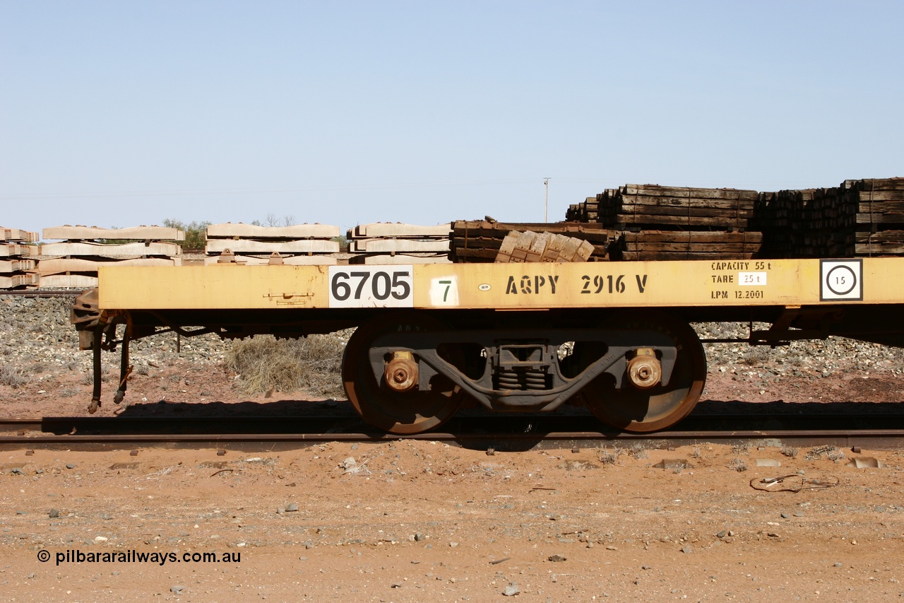 051001 5622
Flash Butt yard, BHP flat waggon 6705 with EDI decal and ROA code of AQPY 2916, 55 tonne capacity, unsure of original owner, possible AN AOOX, then cut down to the Pilbara through CFCLA.
Keywords: 6705;AQPY-type;AQPY2916;CFCLA;BHP-flat-waggon;