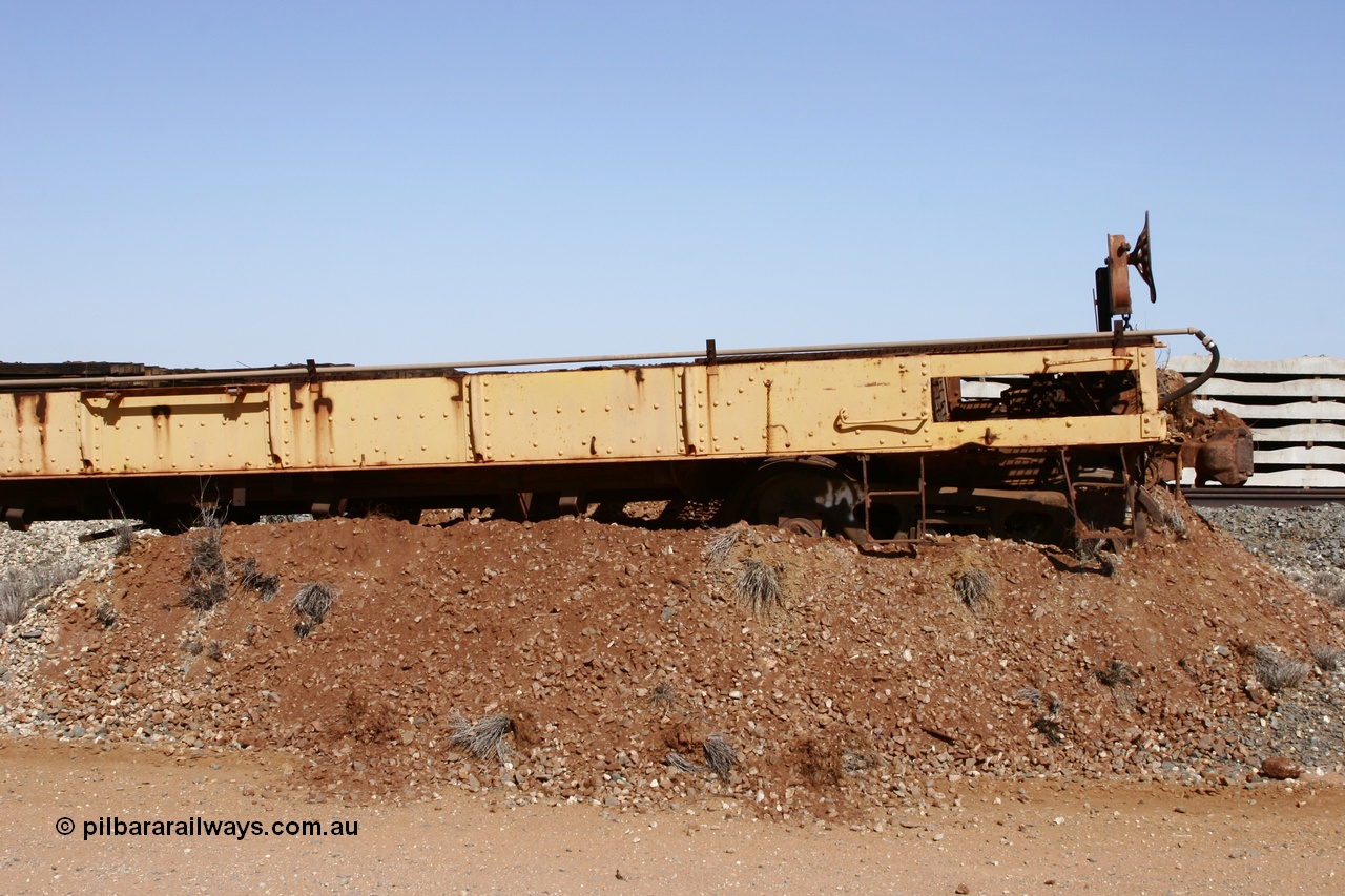 051001 5624
Flash Butt yard, heavily stripped down riveted waggon 206, possible original ballast waggon, number 206 was originally a waggon in the 'Camp Train' and appears to have USA origin, pushed into an earth bund with 55 tonne flat waggon 6705 behind, view from handbrake end.
Keywords: BHP-flat-waggon;