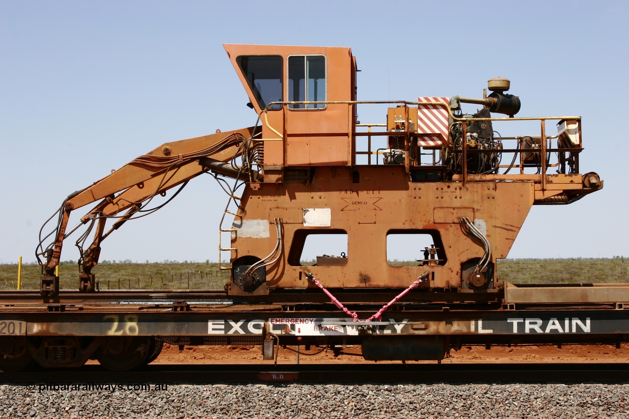 051001 5723
Boodarie, the Steel Train or rail recovery and transport train flat waggon #28, 2nd lead off waggon 6201, built by Comeng WA in January 1977 under order no. 07-M-282 RY, with the Gemco built straddle crane.
Keywords: Comeng-WA;BHP-rail-train;