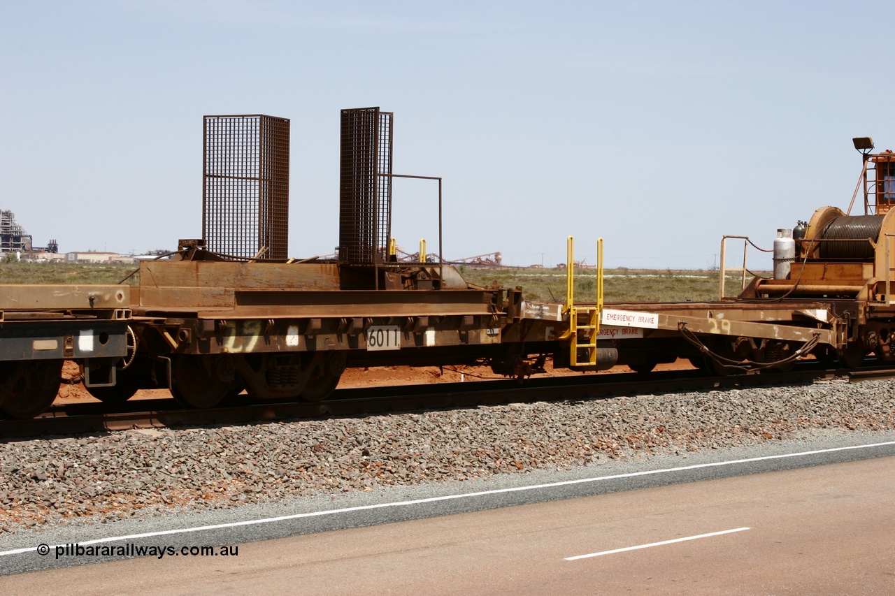 051001 5724
Boodarie, the Steel Train or rail recovery and transport train, 1st lead off waggon 6011, built by Scotts of Ipswich 04-09-1970, the mesh guarding is for the winch cable. The chute arrangement for the discharging and recovery of rail is visible.
Keywords: Scotts-Qld;BHP-rail-train;