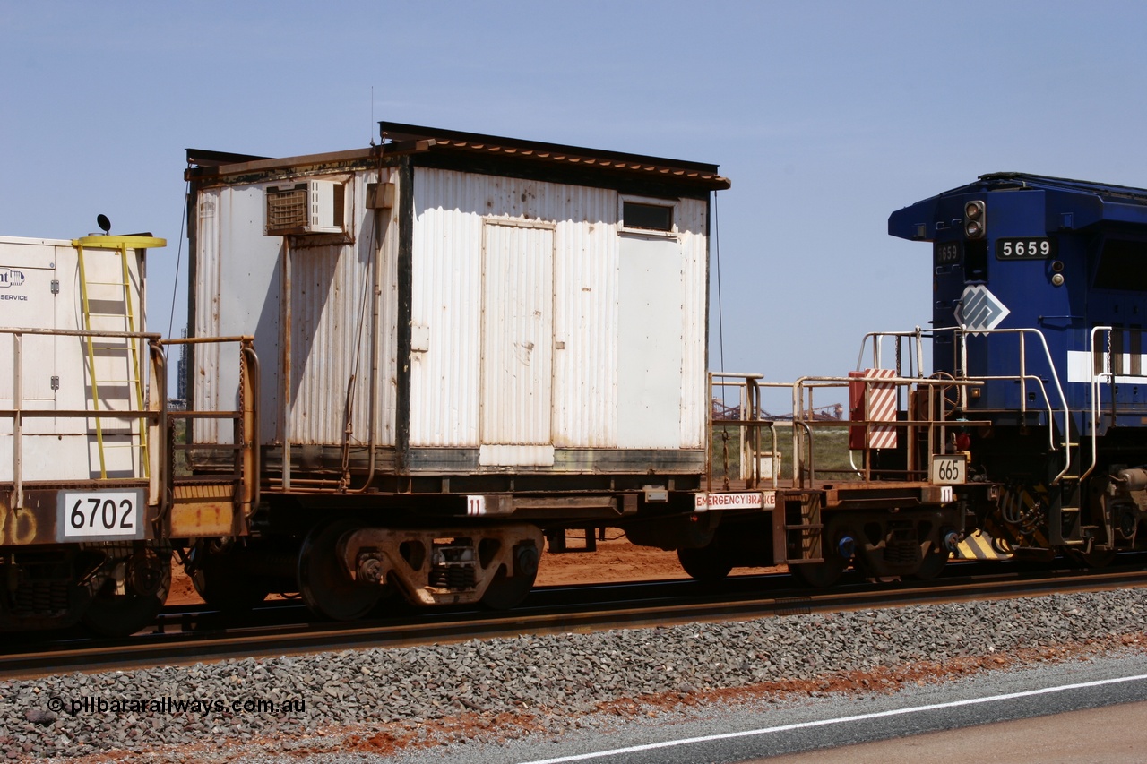 051001 5729
Boodarie, the Steel Train or rail recovery and transport train, cut down by Mt Newman Mining workshops, a Magor USA built former Oroville Dam 91 ton ore waggon 665, seen here being used as the crib waggon on the end of the steel train.
Keywords: Magor-USA;BHP-rail-train;