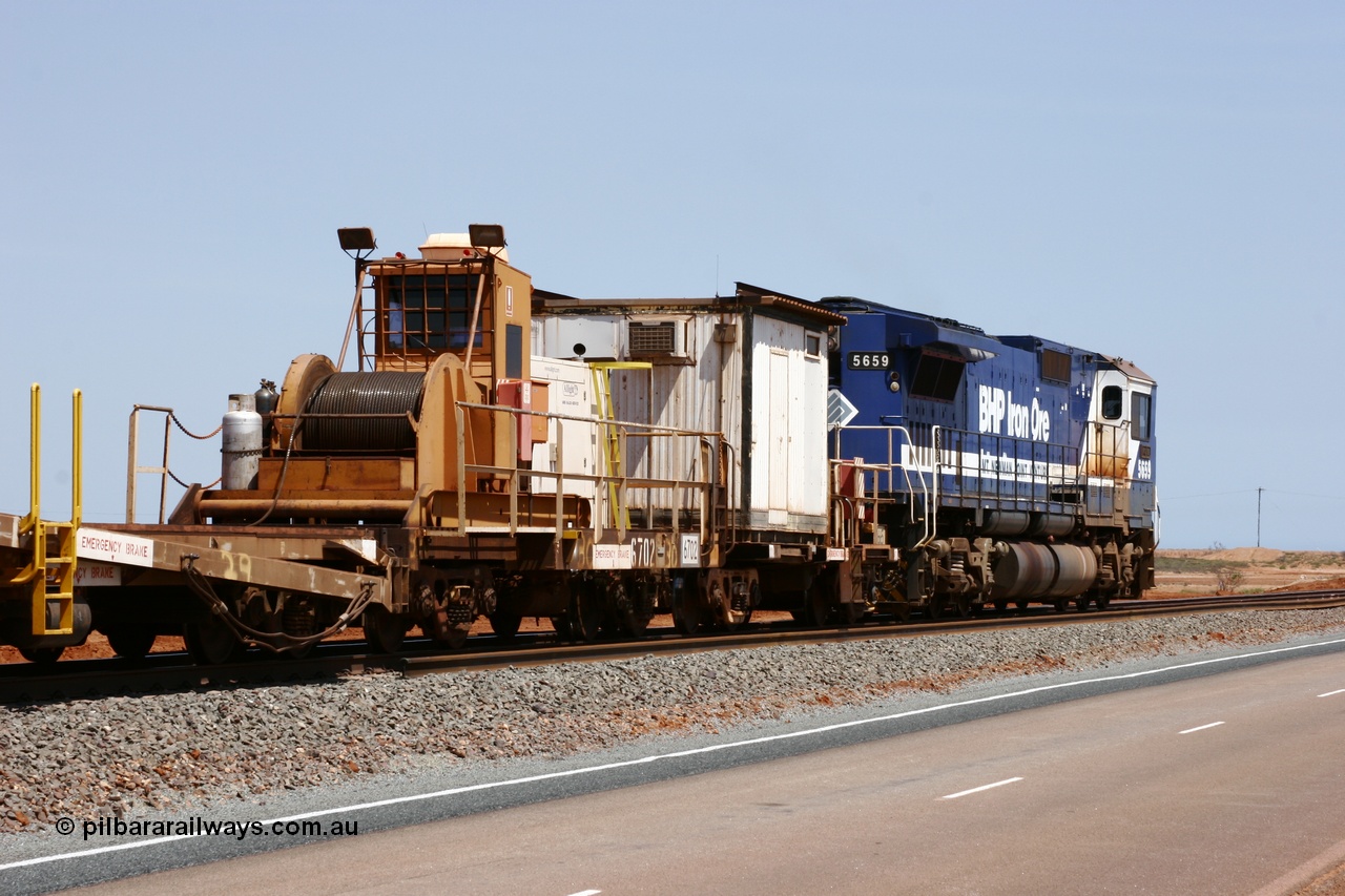 051001 5731
Boodarie, the Steel Train or rail recovery and transport train, flat waggon #30, 6702, heavily cut down and modified Magor USA ore waggon by Mt Newman Mining workshops, converted to a 50 tonne waggon and designated the winch waggon with generator set to power the winch and the crib car.
Keywords: Magor-USA;Mt-Newman-Mining-WS;BHP-rail-train;