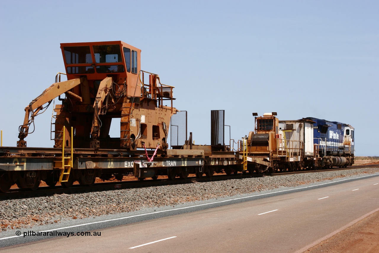 051001 5734
Boodarie, the Steel Train or rail recovery and transport train, flat waggon #28, 2nd lead off waggon 6201, built by Comeng WA in January 1977 under order no. 07-M-282 RY, with the Gemco built straddle crane.
Keywords: Comeng-WA;BHP-rail-train;