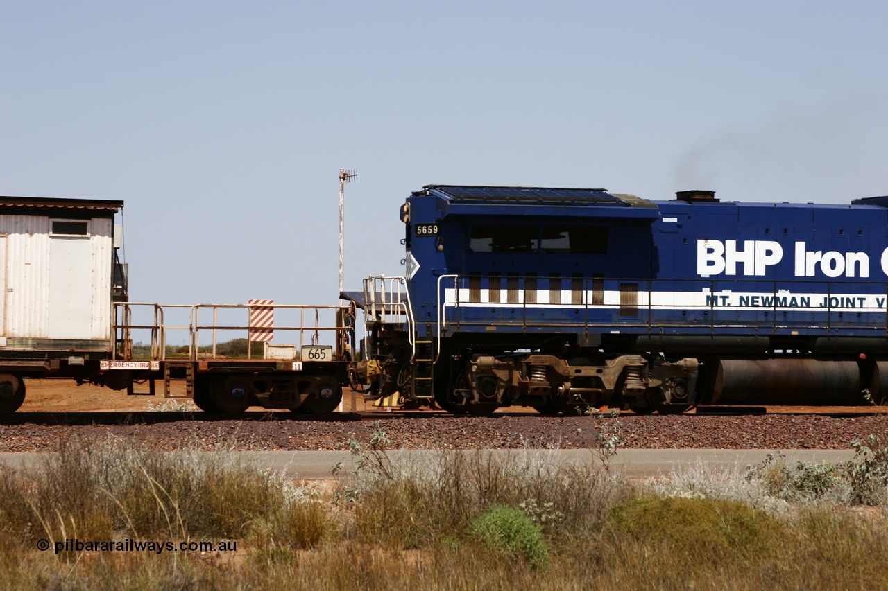 051001 5741
Boodarie, the Steel Train or rail recovery and transport train, cut down by Mt Newman Mining workshops, a Magor USA built former Oroville Dam 91 ton ore waggon 665, seen here being used as the crib waggon on the end of the steel train.
Keywords: Magor-USA;BHP-rail-train;