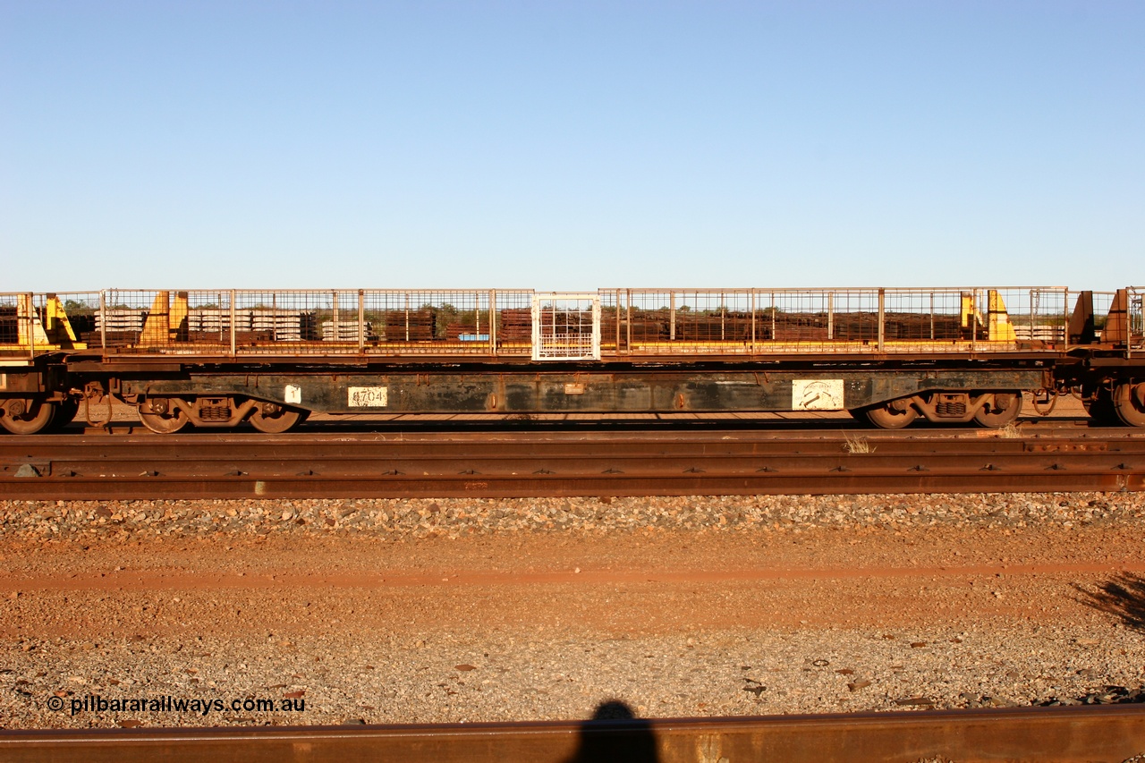 060429 3753
Flash Butt yard, Pony re-laying waggon 6704 flat waggon, unsure of history or who built it or where it came from, it looks to be heavy duty with riveted side frames and an odd handbrake arrangement.
Keywords: BHP-pony-waggon;