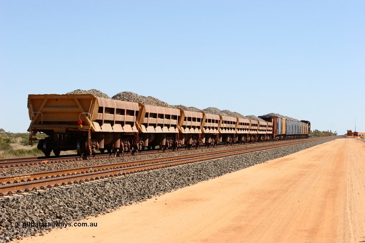 060501 3880
Tabba Siding, a string of Difco side dumps on the rear of a loaded ballast train.
Keywords: Difco-Ohio-USA;GML;BHP-ballast-waggon;