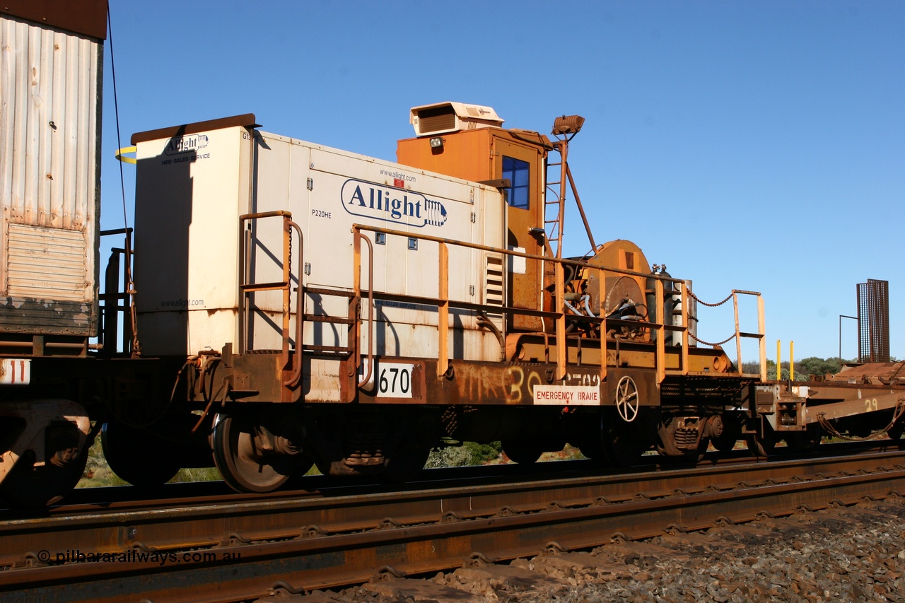 060714 6817
Hesta Siding, rail recovery and transport train flat waggon #30, 6702, heavily cut down and modified Magor USA ore waggon by Mt Newman Mining workshops, converted to a 50 tonne flat waggon and designated the winch waggon with generator set to power the winch and the crib car.
Keywords: Mt-Newman-Mining-WS;Magor-USA;BHP-rail-train;