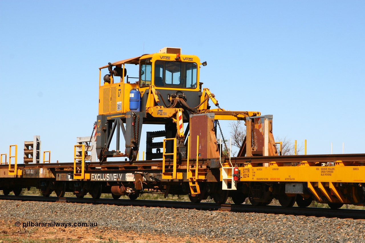 080621 2723
Tabba South, rail recovery and transport train flat waggon #1, rear lead off waggon 6203, built by Comeng WA in January 1977. The straddle crane is a newish unit built by Vaia Car model no. TCR-V and the four wheels are chain driven, replacing the original Gemco hydraulic unit.
Keywords: Comeng-WA;BHP-rail-train;