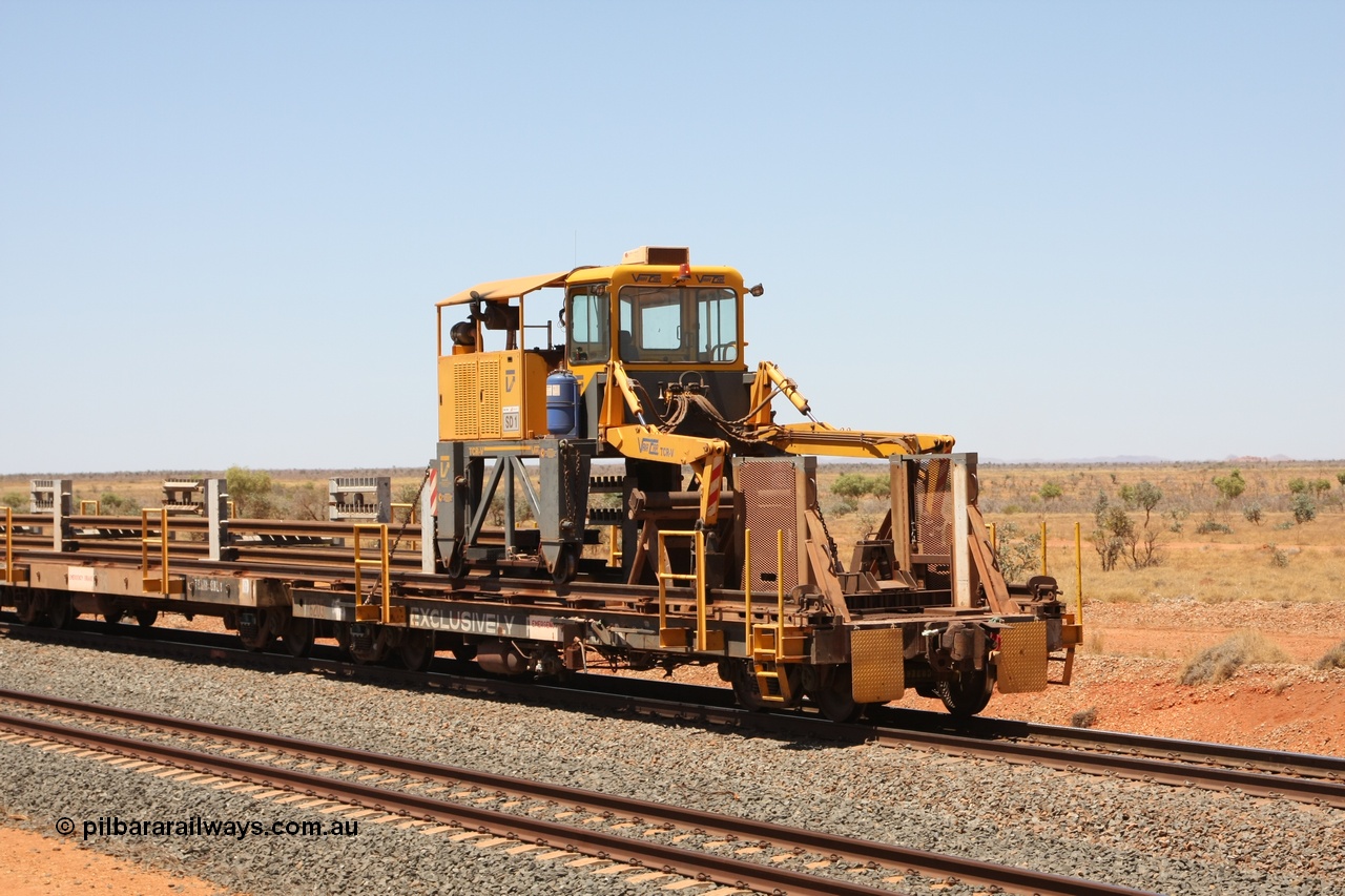 081217 0458
Woodstock Siding, rail recovery and transport train flat waggon #1, rear lead off waggon 6203, built by Comeng WA in January 1977 under order number 07-M-282 RY. The straddle crane is a newish unit built by Vaia Car model no. TCR-V and the four wheels are chain driven, replacing the original Gemco hydraulic unit.
Keywords: Comeng-WA;BHP-rail-train;