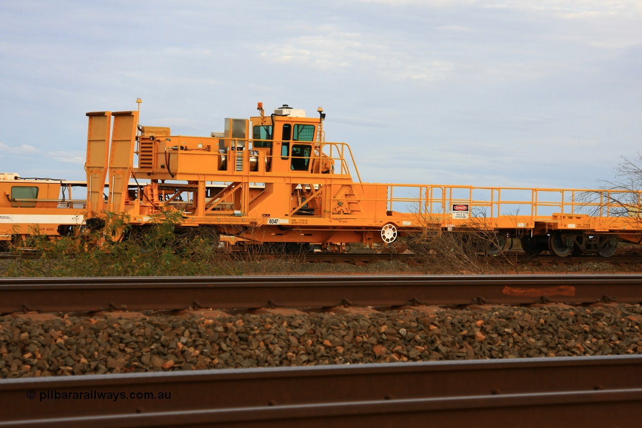 100717 0688
Flash Butt yard, new rail winch waggon 6047 obstructed by scrub, view from A end showing rail ramps, built by Gemco Rail in late 2009-10 with Barber bogies.
Keywords: Gemco-Rail-WA;BHP-rail-train;