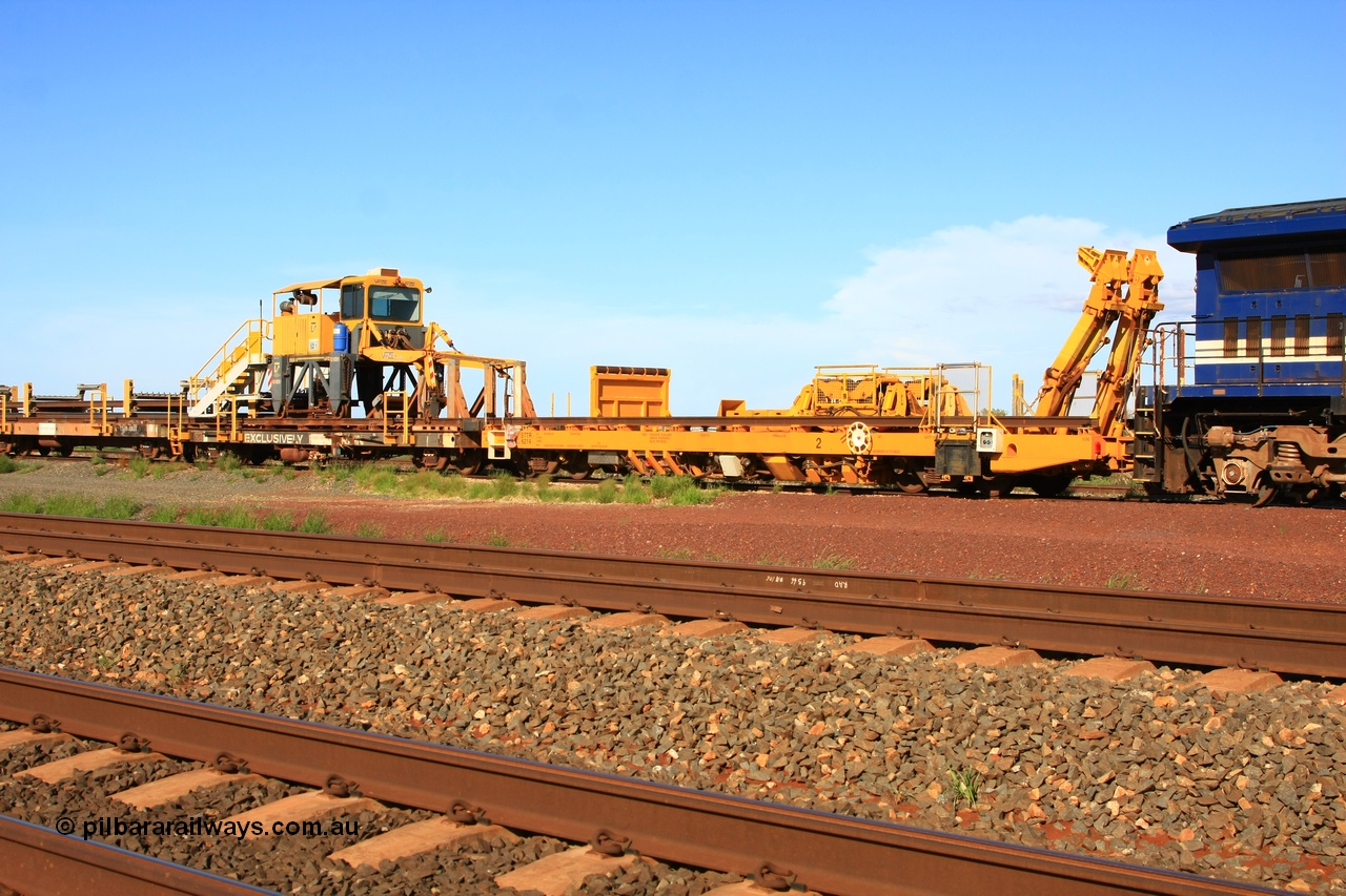 110208 9426
Flash Butt yard, new Lead-Off Lead-On waggon STTR class STTR 6214 on the end of the Steel Train or rail recovery and transport train, built by Gemco Rail WA, the chutes can be seen standing up with the squeeze rollers behind the mesh, with the new straddle crane sitting on flat waggon 6203 an original rear Lead-Off-On waggon.
Keywords: Gemco-Rail-WA;BHP-rail-train;STTR-type;STTR6214;