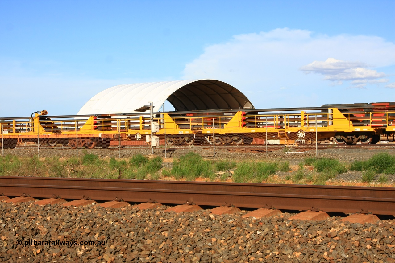 110208 9443
Flash Butt yard, new rail stock carrier waggon 6031 loaded with strings of rail, built by Gemco Rail in late 2009-10 with Barber bogies.
Keywords: BHP-rail-train;Gemco-Rail-WA;