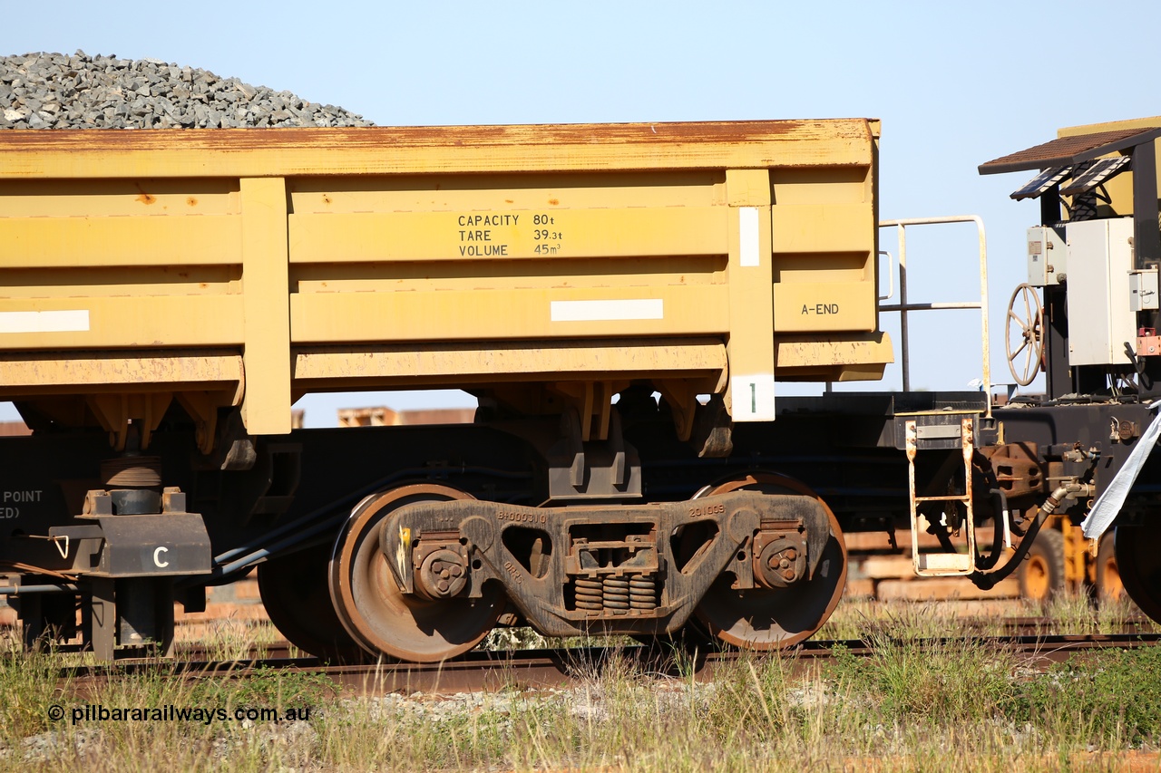 150619 9080
Flash Butt yard, CNR-QRRS of China built side dump waggons, built and delivered around 2011-12, waggon 0710 loaded with fines for sheeting, A end and bogie detail.
Keywords: CNR-QRRS-China;BHP-ballast-waggon;