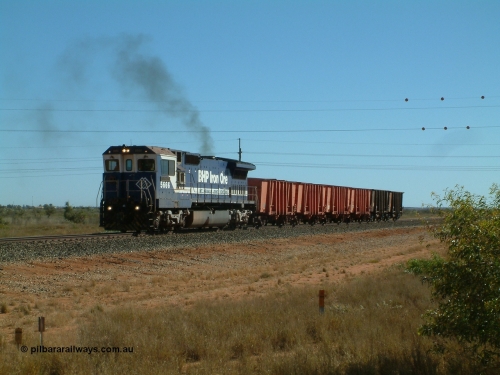 040806 091334
Goldsworthy Junction, 5666 runs the weighbridge test train with the four orange weighbridge test waggons and two ore waggons to provide braking.
