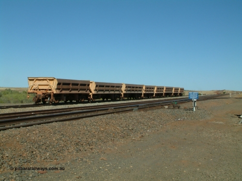 8704 Difco USA 040810 145555
Shaw Siding backtrack, view looking south with Quarry 8 track leading off to the right, a line up of Difco Ohio USA built side dump waggons, a combination of both Mt Newman long and short versions and Goldsworthy Mining short version no. 4 closest to camera.
Keywords: Difco-Ohio-USA;GML;BHP-ballast-waggon;