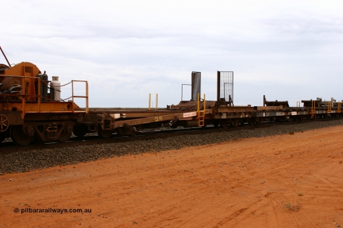 6011 Scotts of Ipswich Qld 050522 2739
Goldsworthy Junction, rail recovery and transport train, 1st lead off waggon 6011, built by Scotts of Ipswich Qld in September 1970, the mesh guarding is for the winch cable. The chute arrangement for the discharging and recovery of rail is visible.
Keywords: Scotts-Qld;BHP-rail-train;