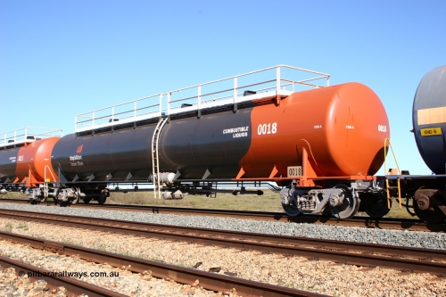 0018 Comeng WA 050704 3976
Bing Siding, empty 116 kL Comeng WA built tank waggon 0018 from 1974-5, one of six such tank waggons, wearing the BHP Billiton Earth livery.
Keywords: Comeng-WA;BHP-tank-waggon;