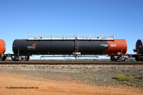 0018 Comeng WA 050704 3983
Bing Siding, empty 116 kL Comeng WA built tank waggon 0018 from 1974-5, one of six such tank waggons, wearing the BHP Billiton Earth livery, side view.
Keywords: Comeng-WA;BHP-tank-waggon;