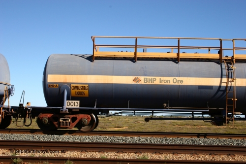 0013 Comeng WA 050704 3989
Bing Siding, empty 116 kL Comeng WA built tank waggon 0013 from 1974-5, one of six such tank waggons, detail of A end and bogie.
Keywords: Comeng-WA;BHP-tank-waggon;