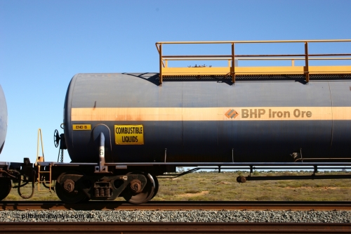 0016 Comeng WA 050704 3994
Bing Siding, empty 116 kL Comeng WA built tank waggon 0016 from 1974-5, one of six such tank waggons, detail of A end and bogie.
Keywords: Comeng-WA;BHP-tank-waggon;