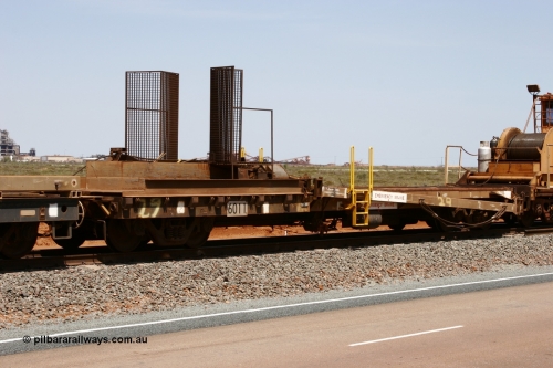 6011 Scotts of Ipswich Qld 051001 5724
Boodarie, the Steel Train or rail recovery and transport train, 1st lead off waggon 6011, built by Scotts of Ipswich 04-09-1970, the mesh guarding is for the winch cable. The chute arrangement for the discharging and recovery of rail is visible.
Keywords: Scotts-Qld;BHP-rail-train;