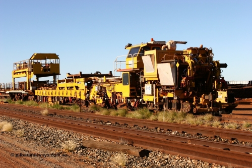 060429 3719
Flash Butt yard, a view along the Harsco 'Pony' track resleeping and relaying machine and sleeper carting waggons and gantry trolley.
Keywords: Harsco;Pony-Track-Relayer;