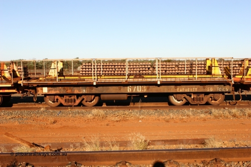 6703 Mt Newman Mining Workshops 060429 3749
Flash Butt yard, Pony re-laying waggon 6703 is a heavily cut down and modified Magor USA ore waggon done by Mt Newman Mining workshops, converted to a 50 tonne flat waggon.
Keywords: BHP-pony-waggon;Magor-USA;Mt-Newman-Mining-WS;