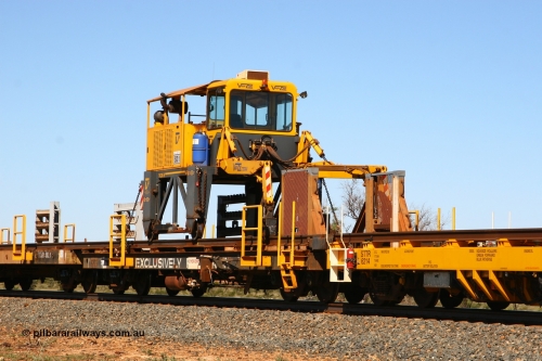 6203 Comeng WA 080621 2723
Tabba South, rail recovery and transport train flat waggon #1, rear lead off waggon 6203, built by Comeng WA in January 1977. The straddle crane is a newish unit built by Vaia Car model no. TCR-V and the four wheels are chain driven, replacing the original Gemco hydraulic unit.
Keywords: Comeng-WA;BHP-rail-train;