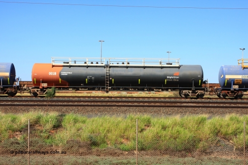 0018 Comeng WA 110411 10002
Nelson Point, empty 116 kL Comeng WA built tank waggon 0018 from 1974-5, one of six such tank waggons, wearing the BHP Billiton Earth livery.
Keywords: Comeng-WA;BHP-tank-waggon;