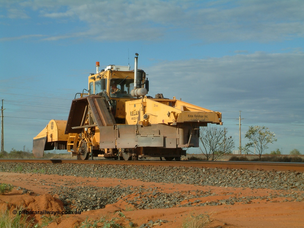 040407 073334
Goldsworthy Junction, Barclay Mowlem's R.E.L.A.M lease ballast plough, Knox Kershaw KBR 850 model travels east along the Goldsworthy line. 7th April 2004.
Keywords: Knox-Kershaw;KBR-850;track-machine;