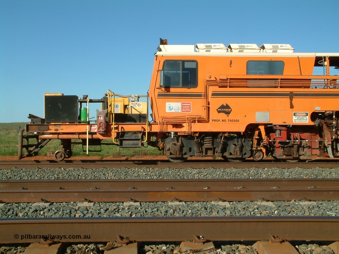 040408 162741
Mooka Siding north backtrack, side view of the driving cab end of BHP's mainline Tamper 1, Plasser Australia 09-32 CAT model with serial 306. 8th April 2004.
Keywords: Tamper1;Plasser-Australia;09-32-CAT;306;track-machine;