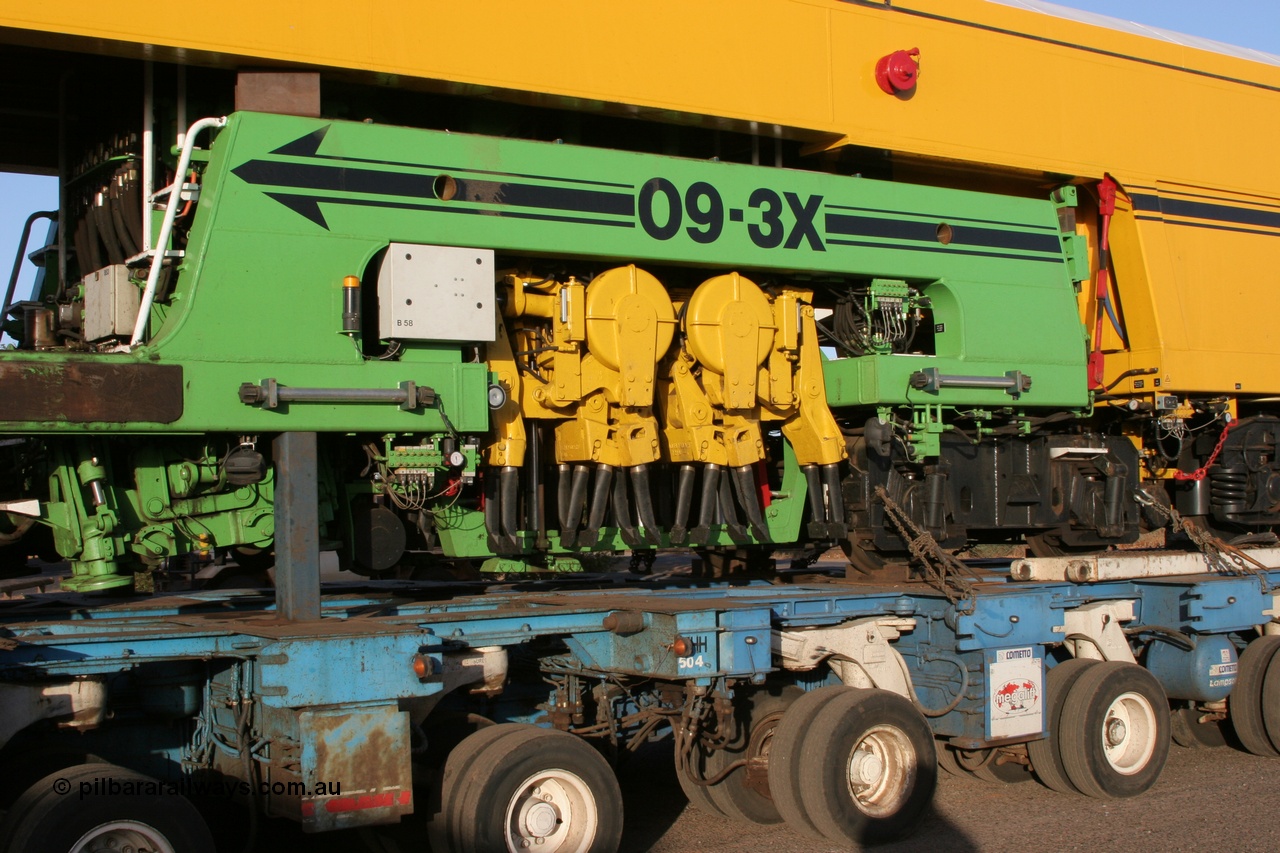 050409 0391
Shell Swagman Roadhouse, Lampson eighty wheel float ready to deliver BHP's new mainline tamper a Plasser Australia 09-3X model with serial M480 view of tamper frame and mechanism. 9th April 2005.
Keywords: Tamper3;Plasser-Australia;09-3X;M480;track-machine;