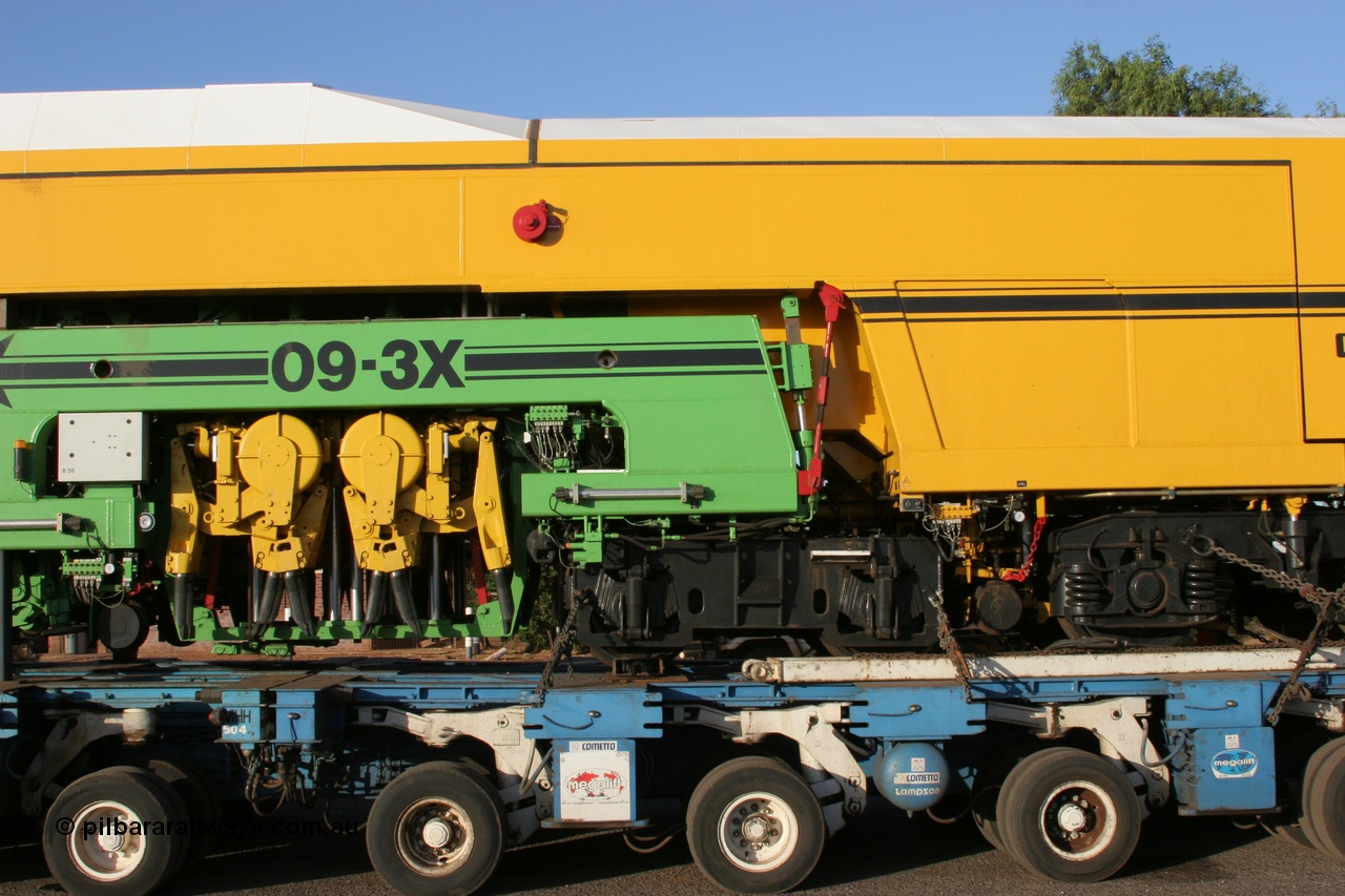 050409 0407
Shell Swagman Roadhouse, Lampson eighty wheel float ready to deliver BHP's new mainline tamper a Plasser Australia 09-3X model with serial M480 side view tamper mechanism and frame bogie. 9th April 2005.
Keywords: Tamper3;Plasser-Australia;09-3X;M480;track-machine;