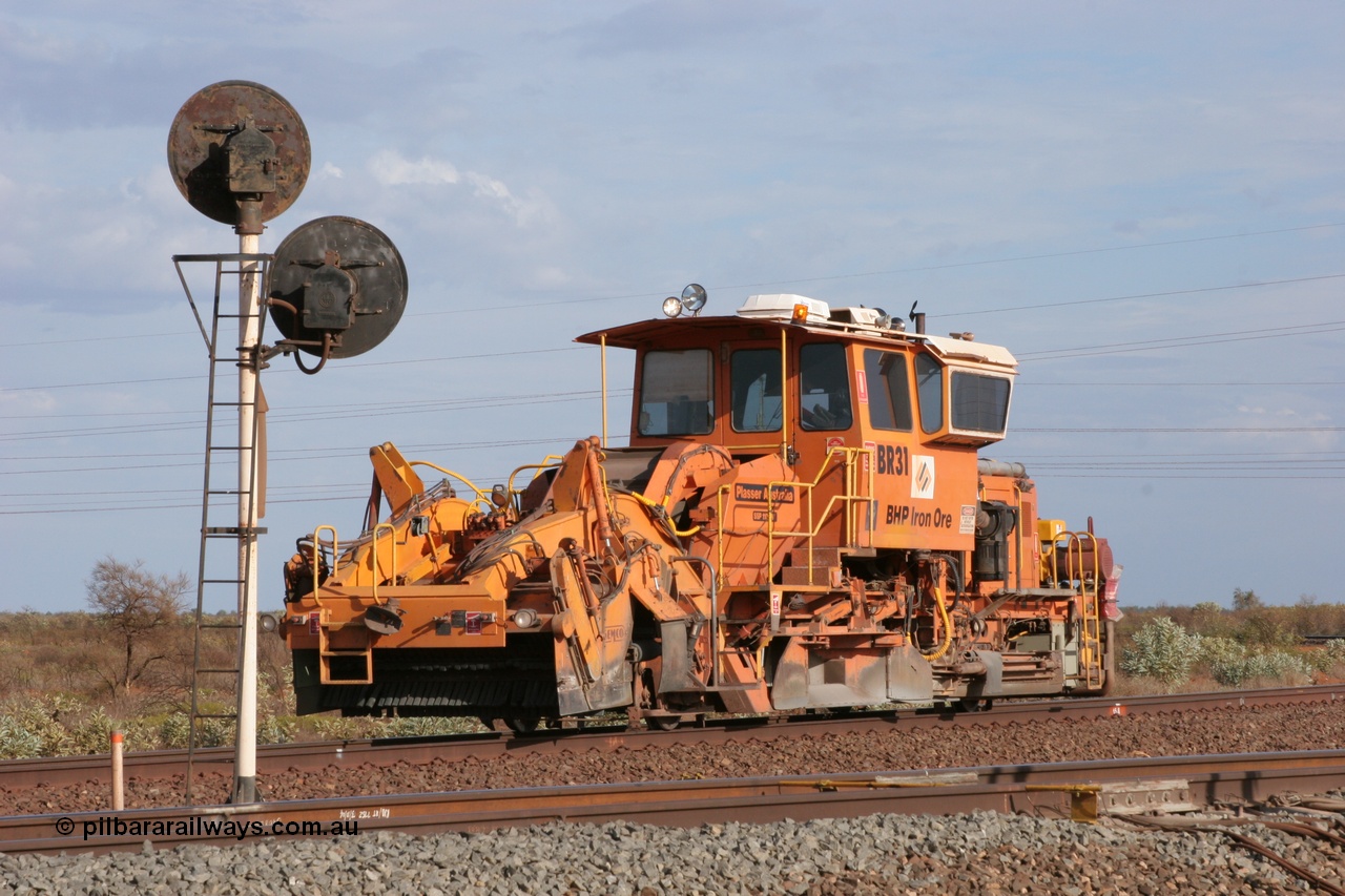 050411 0597
Goldsworthy Junction, BHP track machine ballast regulator BR 31 a Plasser Australia SSP 110SW model with serial 401 comes off the former Goldsworthy line at signal GJ 9 which has two heads due to the curve of the line. 11th April 2005.
Keywords: BR31;Plasser-Australia;SSP-110SW;401;track-machine;