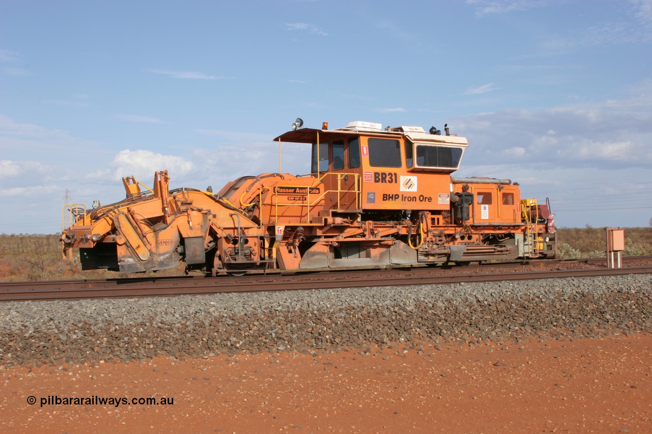 050411 0599
Goldsworthy Junction, BHP track machine ballast regulator BR 31 a Plasser Australia SSP 110SW model with serial 401 comes off the former Goldsworthy line at signal GJ 9 with the Newman mainline in the foreground. 11th April 2005.
Keywords: BR31;Plasser-Australia;SSP-110SW;401;track-machine;