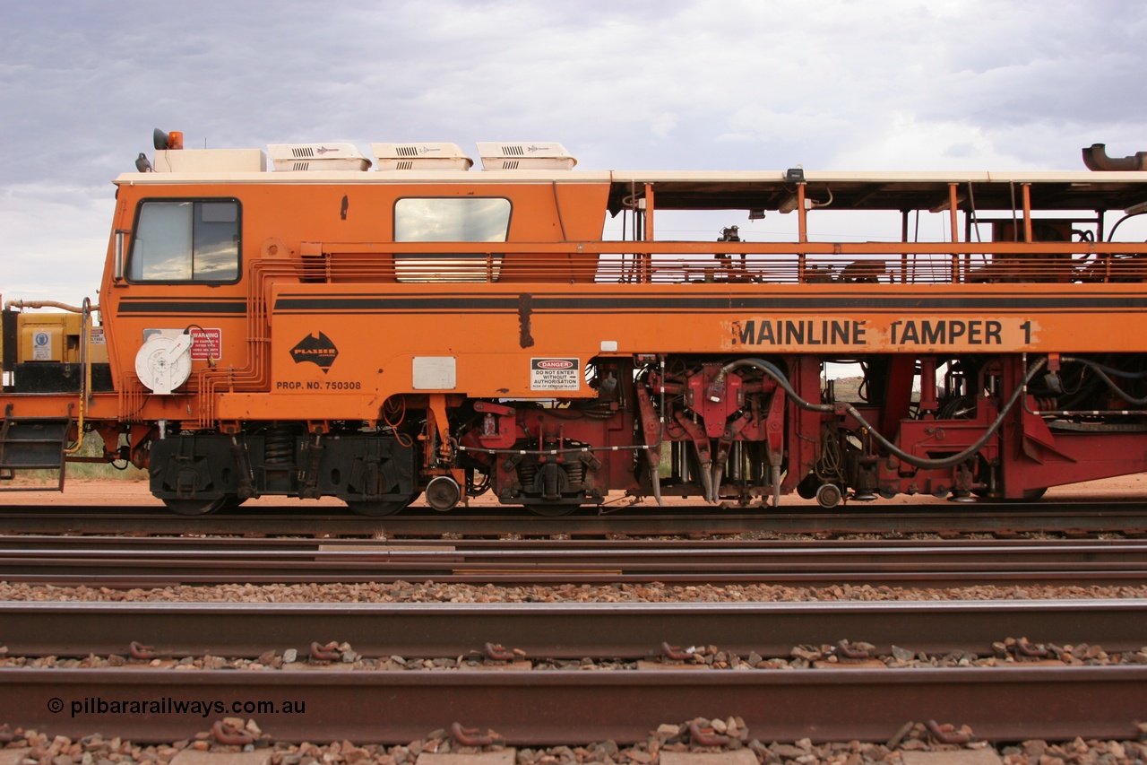 050412 0816
Abydos Siding backtrack, view of cab side and the tamper mechanism of BHP's Mainline Tamper 1, a Plasser Australia 09-32 CAT model tamper serial 306 built in 1986. 12th April 2005.
Keywords: Tamper1;Plasser-Australia;09-32-CAT;306;track-machine;